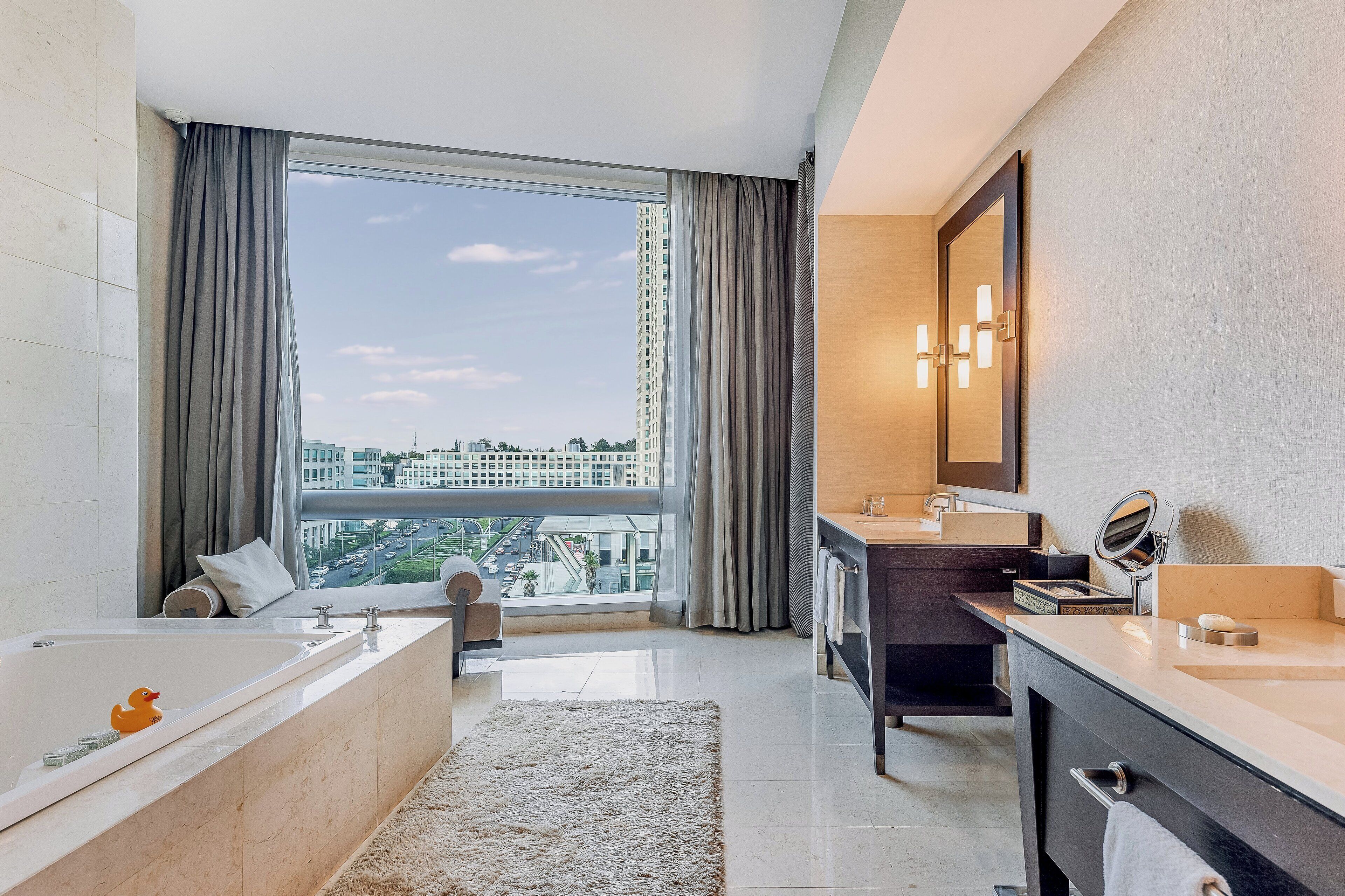 separate bathtub and shower, designer toiletries, hair dryer, bathrobes