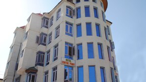A multi-story hotel with a sign reading "HOTEL CENTRE POINT". - Hotel Centre Point (Srinagar)