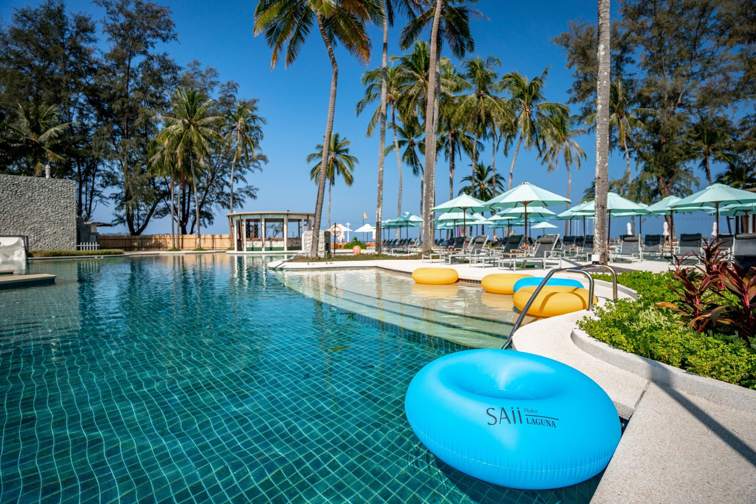 outdoor pool, pool umbrellas, pool loungers