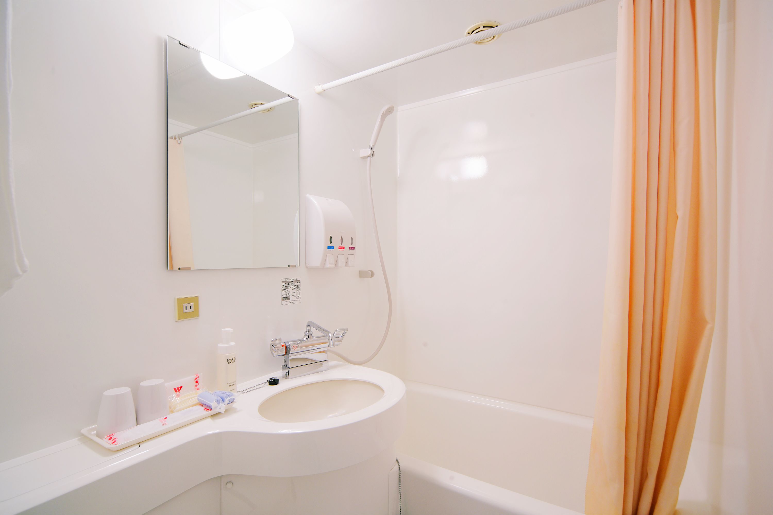combined shower/bathtub, free toiletries, hair dryer, slippers