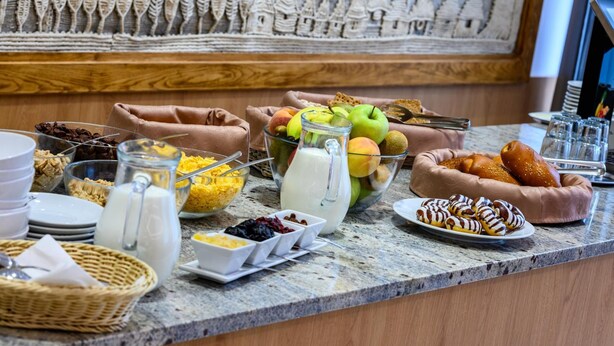 A breakfast buffet with various food items and beverages. - Lux Hotel (Banska Bystrica)