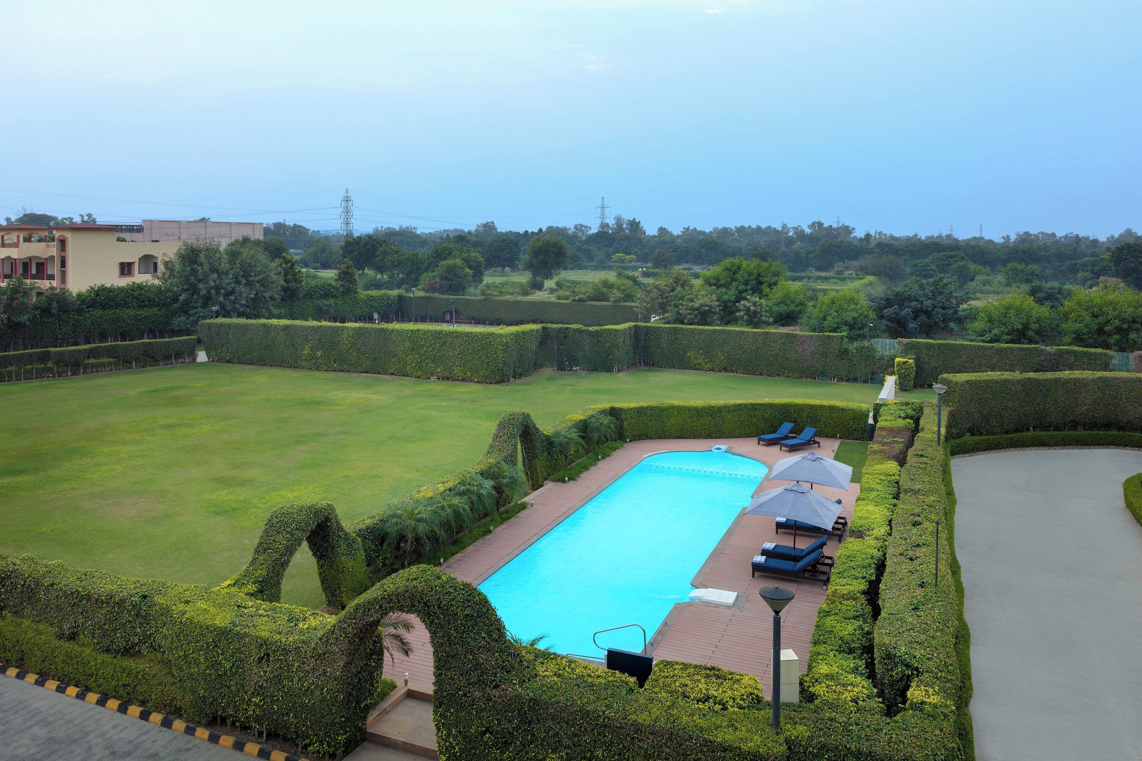 premier room, 2 single beds | pool | outdoor pool, pool umbrellas, pool loungers