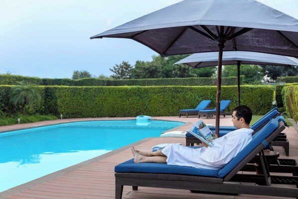 Outdoor pool, pool umbrellas, pool loungers
