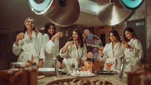 A group of people in a spa setting, holding drinks and toasting. - Crowne Plaza Ahmedabad City Centre by IHG (Ahmedabad)