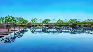 Outdoor pool, open 7:00 AM to 7:00 PM, pool umbrellas, sun loungers