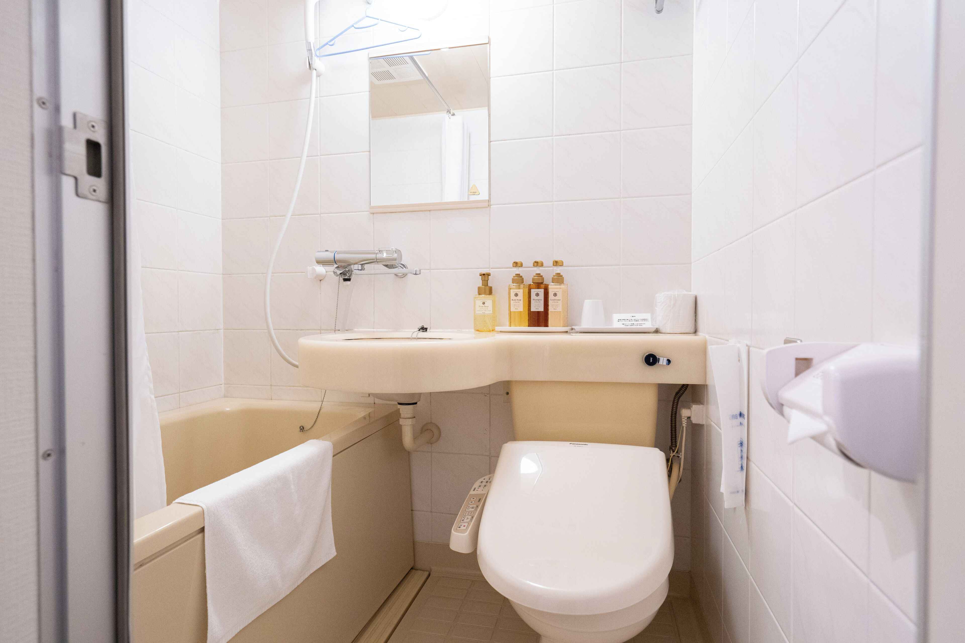 combined shower/bathtub, free toiletries, hair dryer, slippers