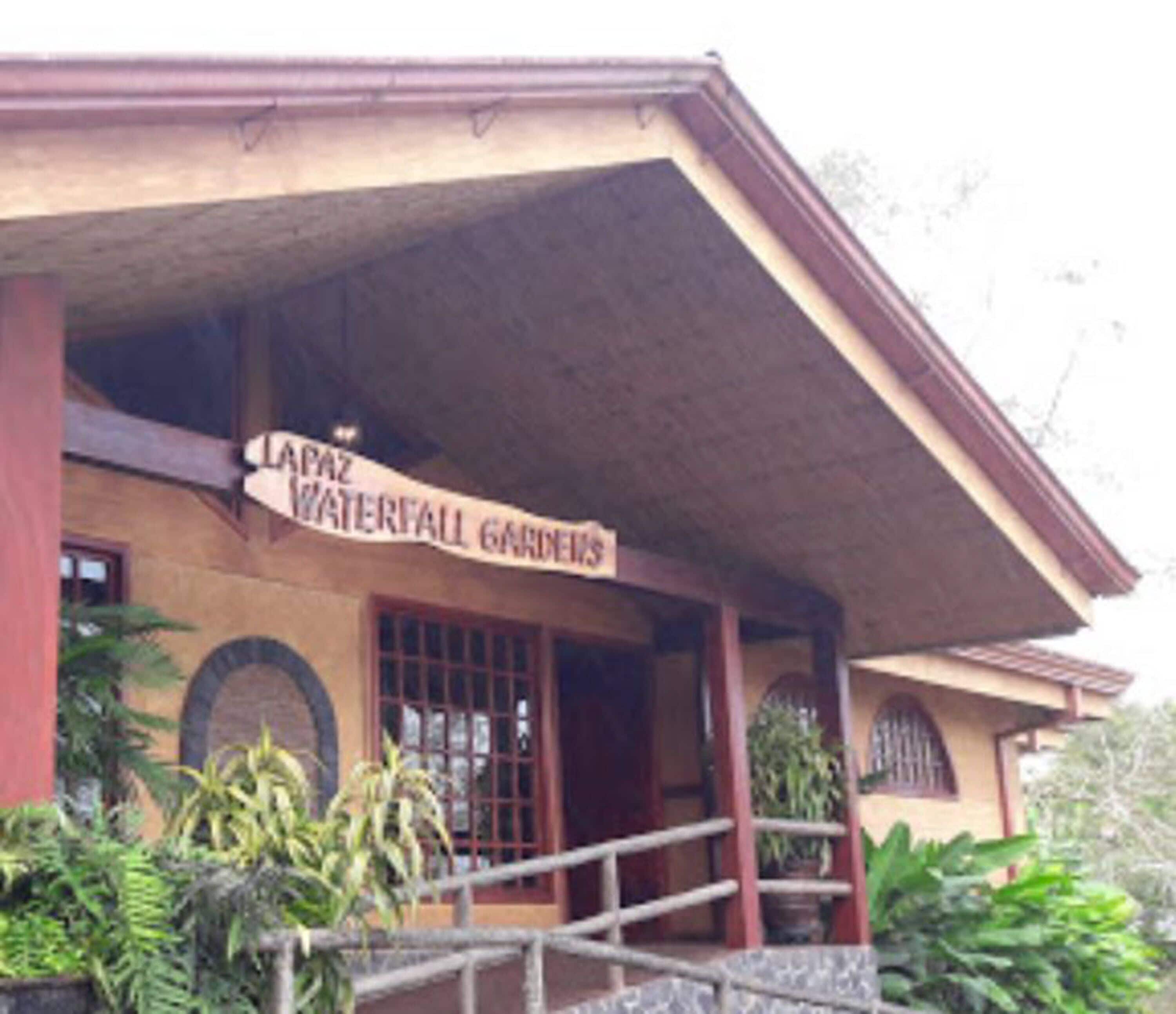 A building with a sign reading "LAPAZ WATERFALL GARDENS".
