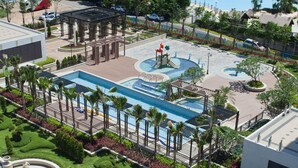 A resort with a swimming pool, a gazebo, and a dome structure.