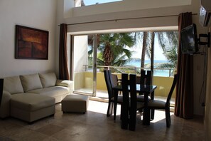 Standard Apartment, 2 Bedrooms, Sea View, Beachside | Living room | 30-inch flat-screen TV with satellite channels, TV, DVD player