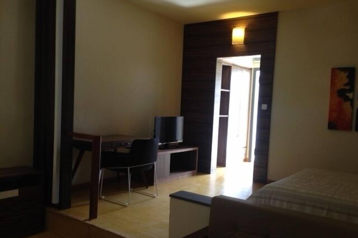 Habitación superior | Minibar, caja fuerte, cortinas opacas y cunas gratuitas