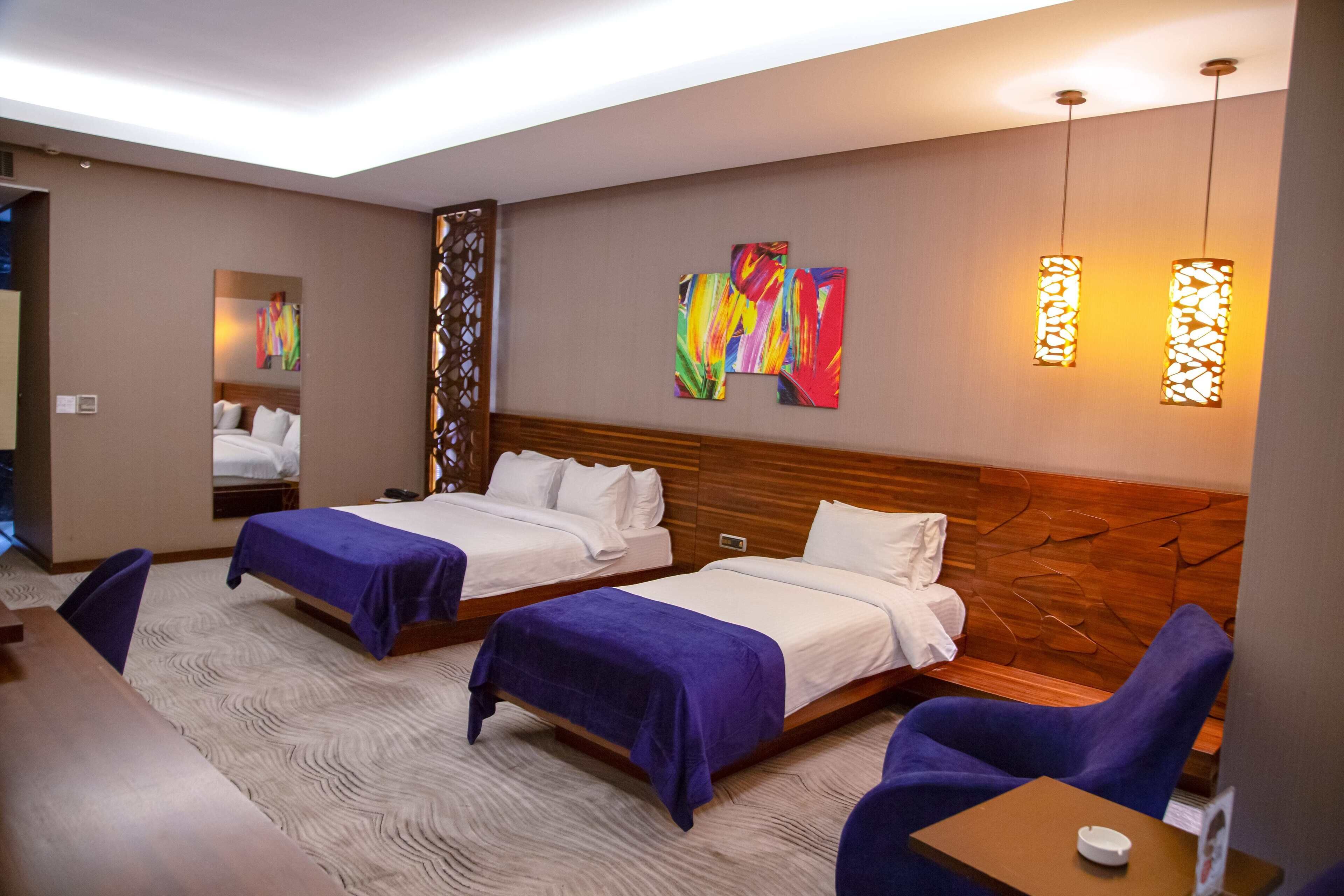 family room | premium bedding, minibar, in-room safe, individually decorated
