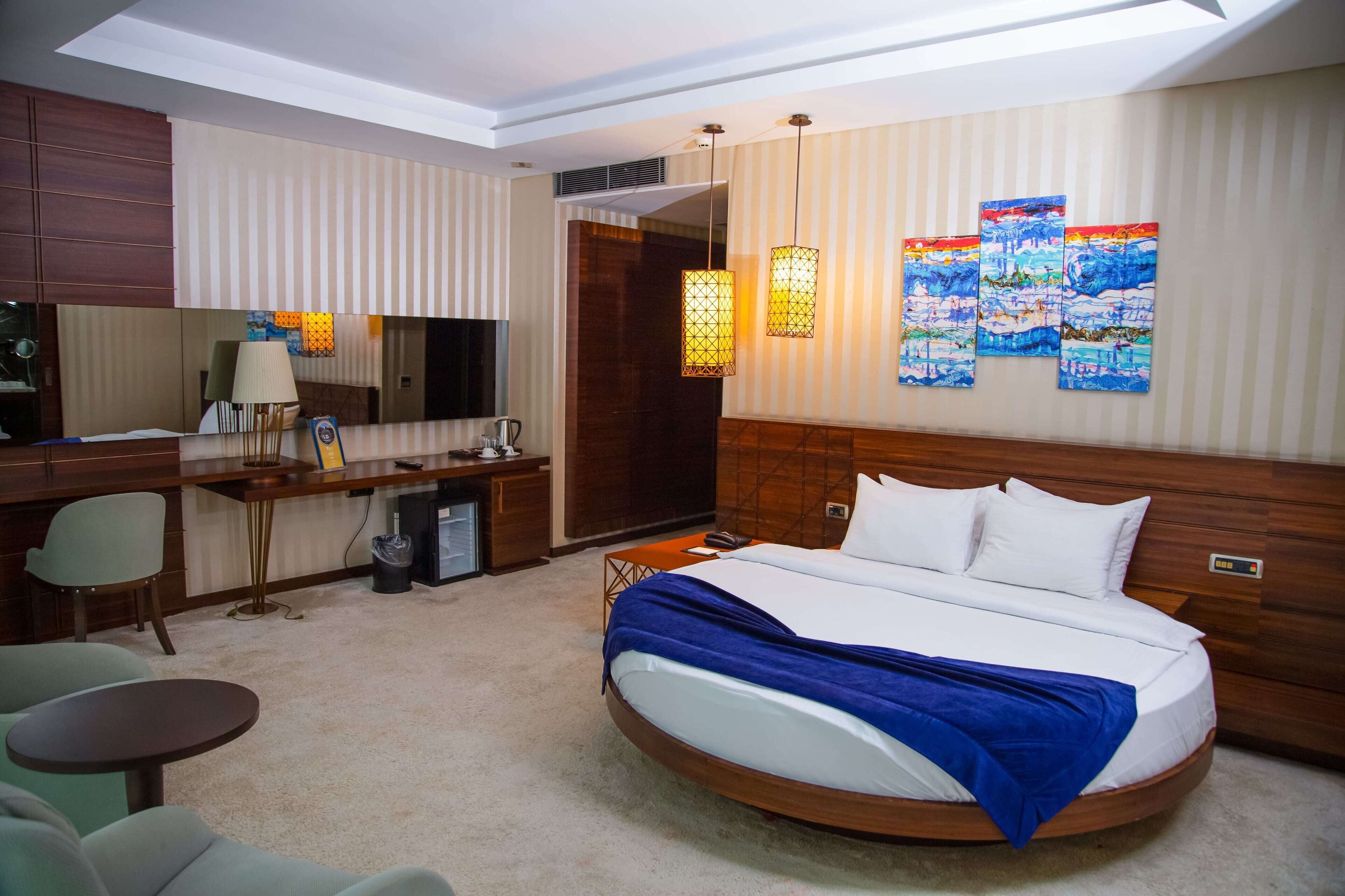 deluxe room | premium bedding, minibar, in-room safe, individually decorated