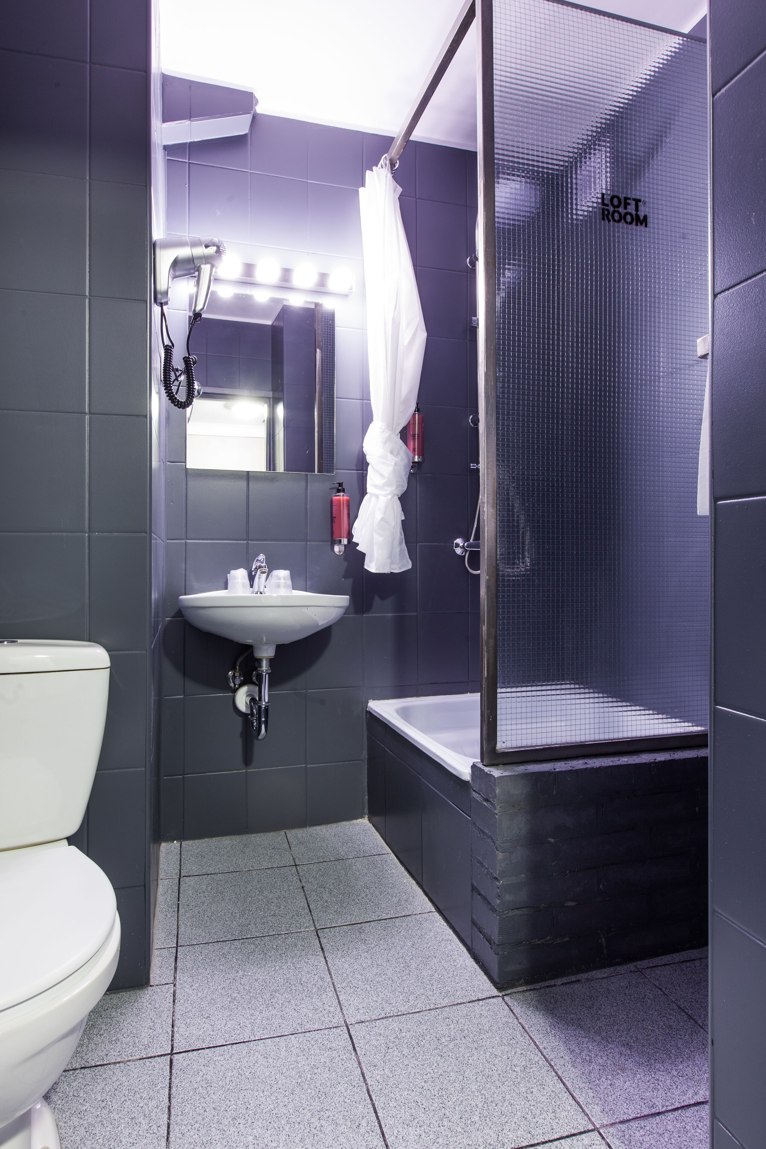 loft room with king size bed | bathroom | free toiletries, hair dryer, towels