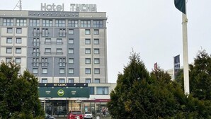 A multi-story hotel building with a sign reading "Hotel Tychy". -  B&B HOTEL Tychy (Tychy)