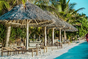 Private beach, white sand, sun-loungers, beach umbrellas