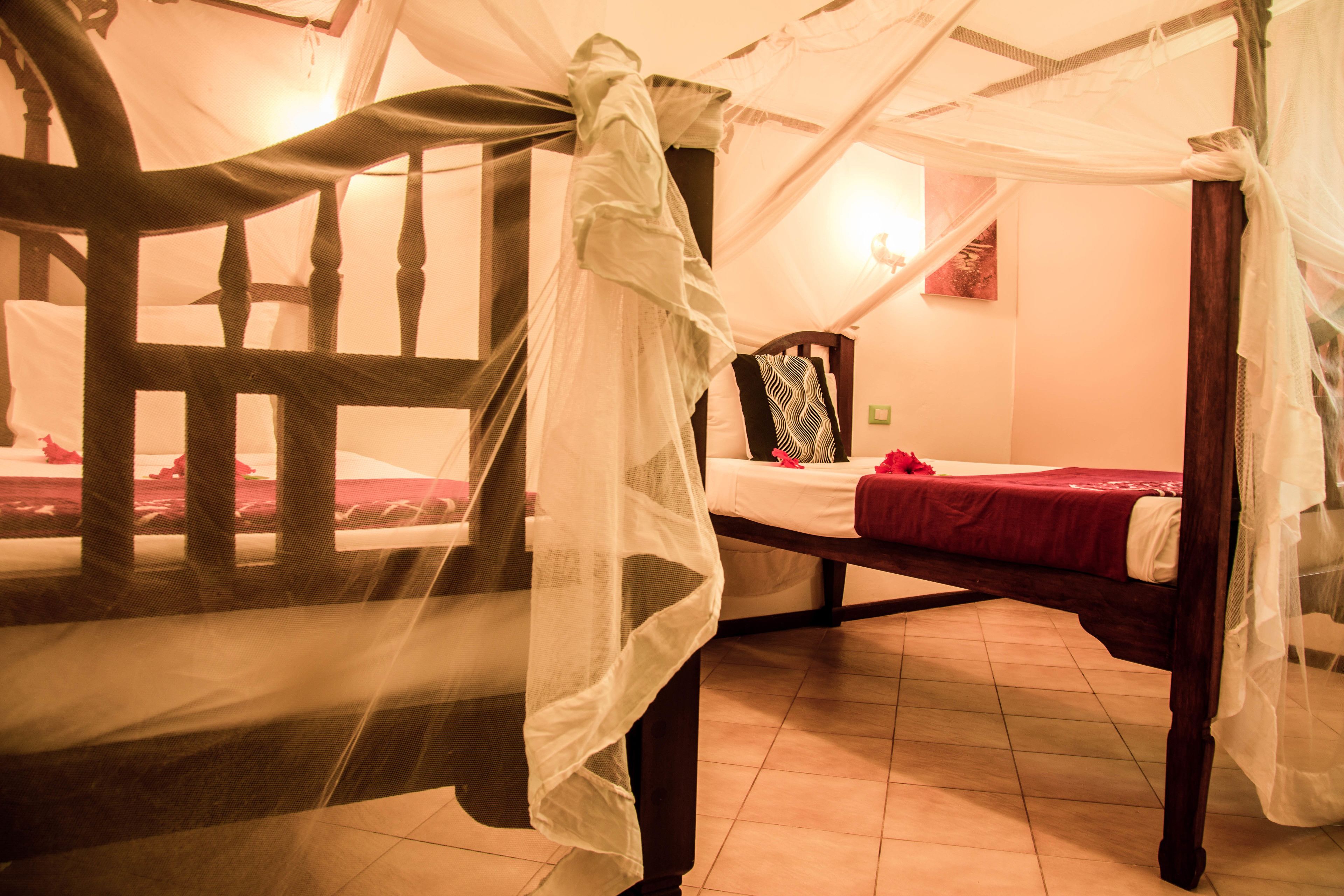 standard triple room, garden view | in-room safe, desk, blackout curtains, free cots/infant beds