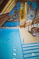 Indoor pool, open noon to 8:00 PM, pool loungers