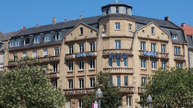 A historic hotel with multiple balconies, a central tower, and a classic architectural style. - Hôtel Alerion (Metz)