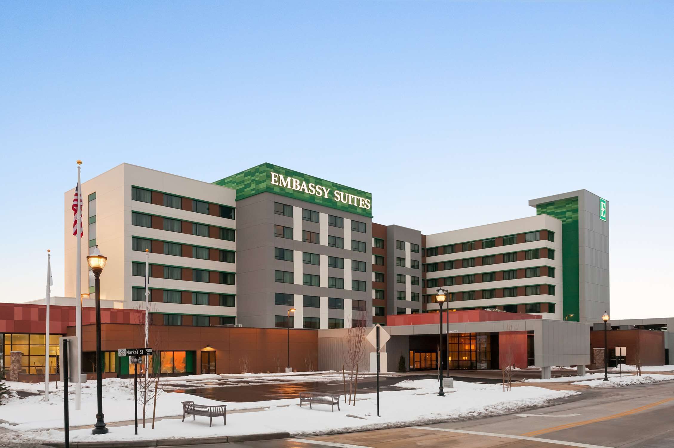 A multi-story building with a sign reading "EMBASSY SUITES".