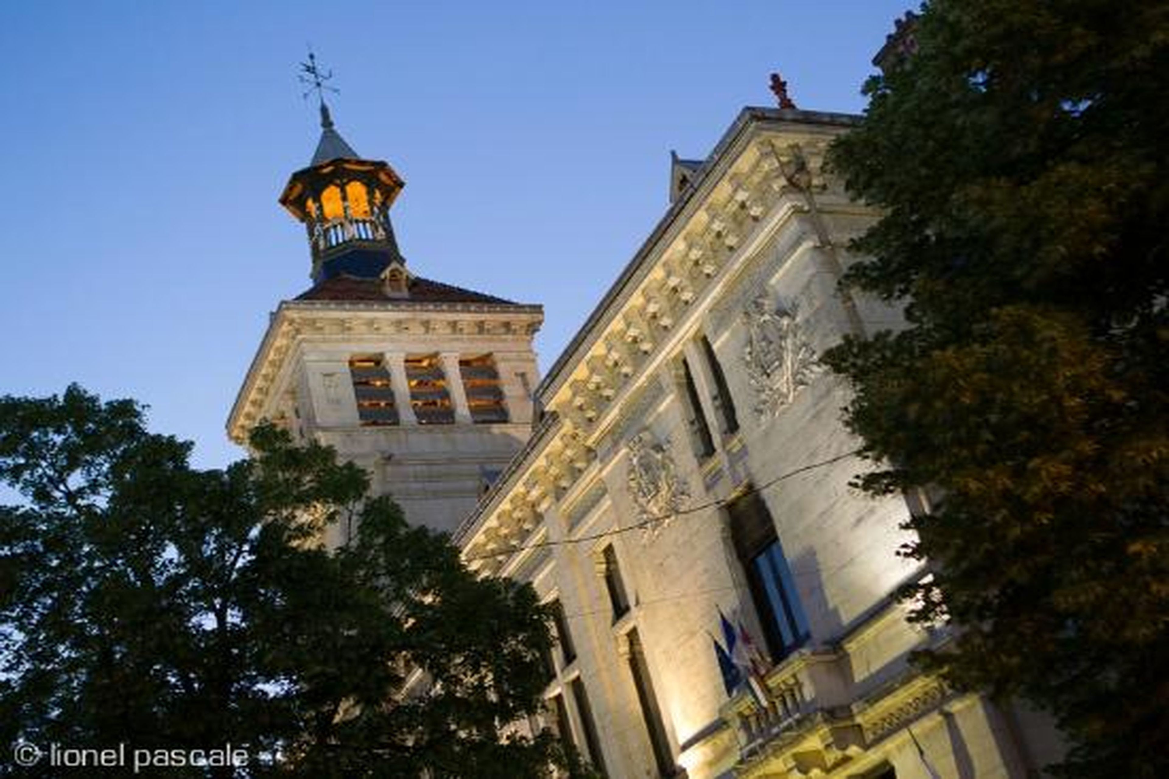 A historic building with classical architecture, including a prominent tower and detailed facade.