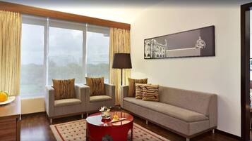 Deluxe Suite, 1 King Bed, City View (One-way Airport Transfer Included) | Premium bedding, free minibar items, in-room safe