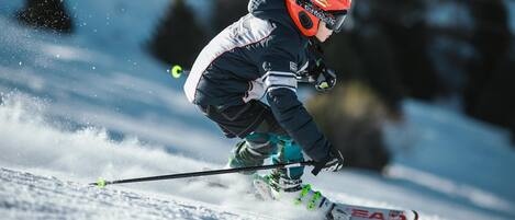 A person skiing on a snowy slope.
