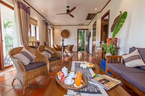 Deluxe Suite, 1 King Bed, River View | Living room | Flat-screen TV