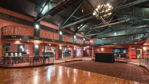 A spacious indoor venue with a high ceiling, multiple levels, and a central open area. - Chermside Court Motel (Chermside)