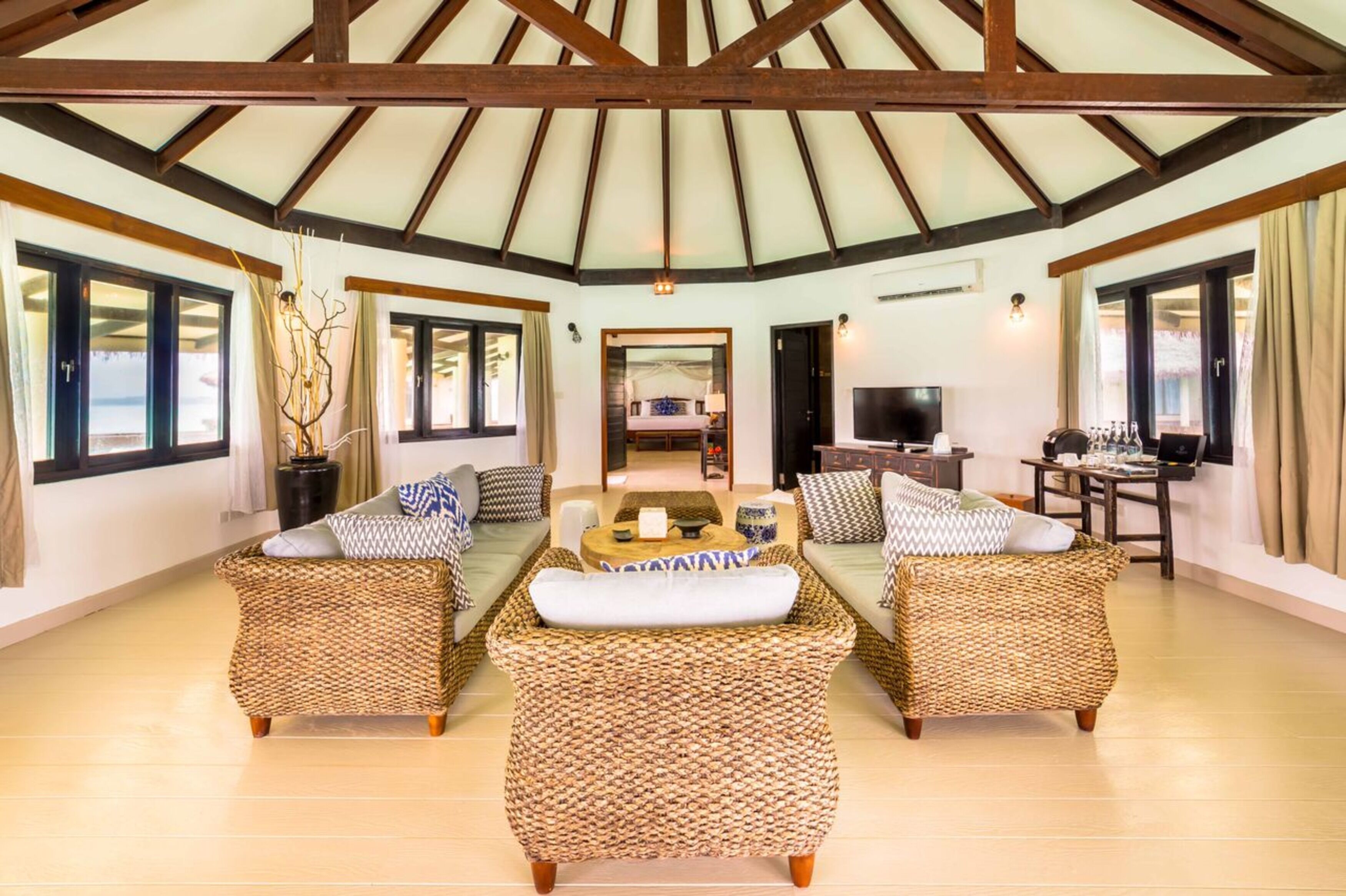 two bed overwater sunset suite | living area | 42-inch flat-screen tv with satellite channels, tv