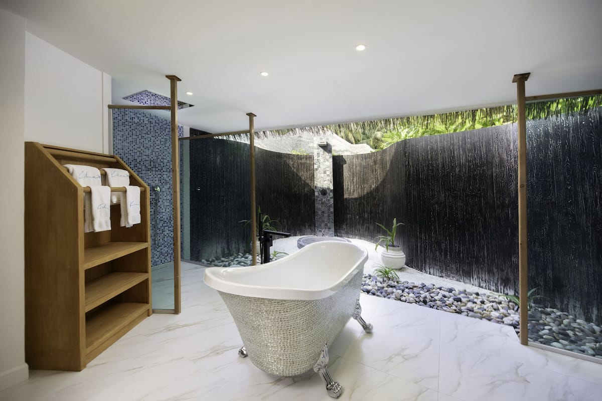 sunset beach suite with infinity pool | bathroom | rainfall showerhead, free toiletries, hair dryer, bathrobes