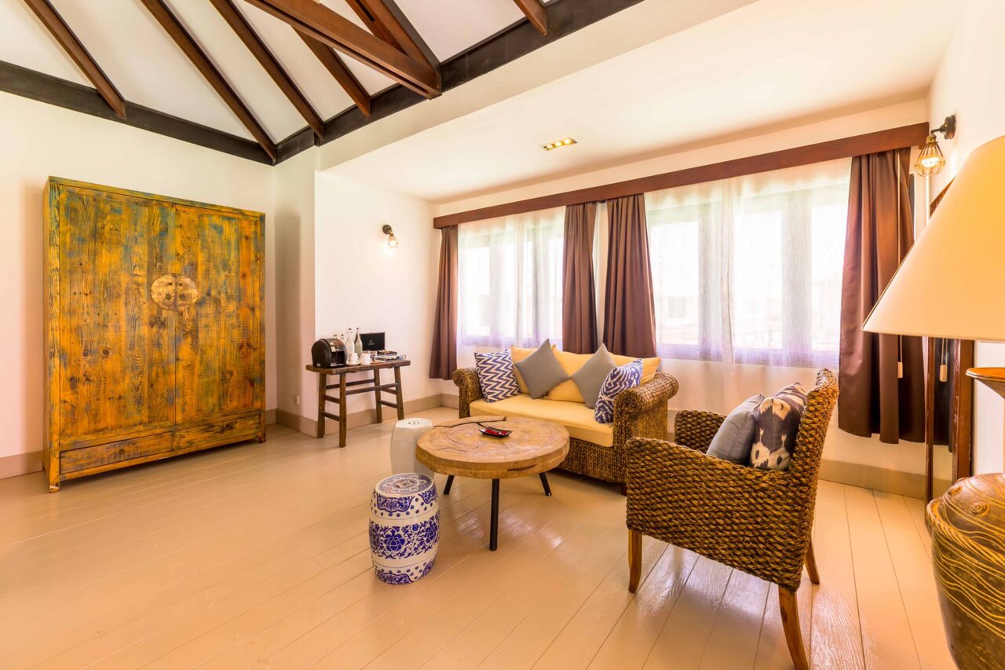 sunset overwater villa with infinity pool | living area | 42-inch flat-screen tv with satellite channels, tv
