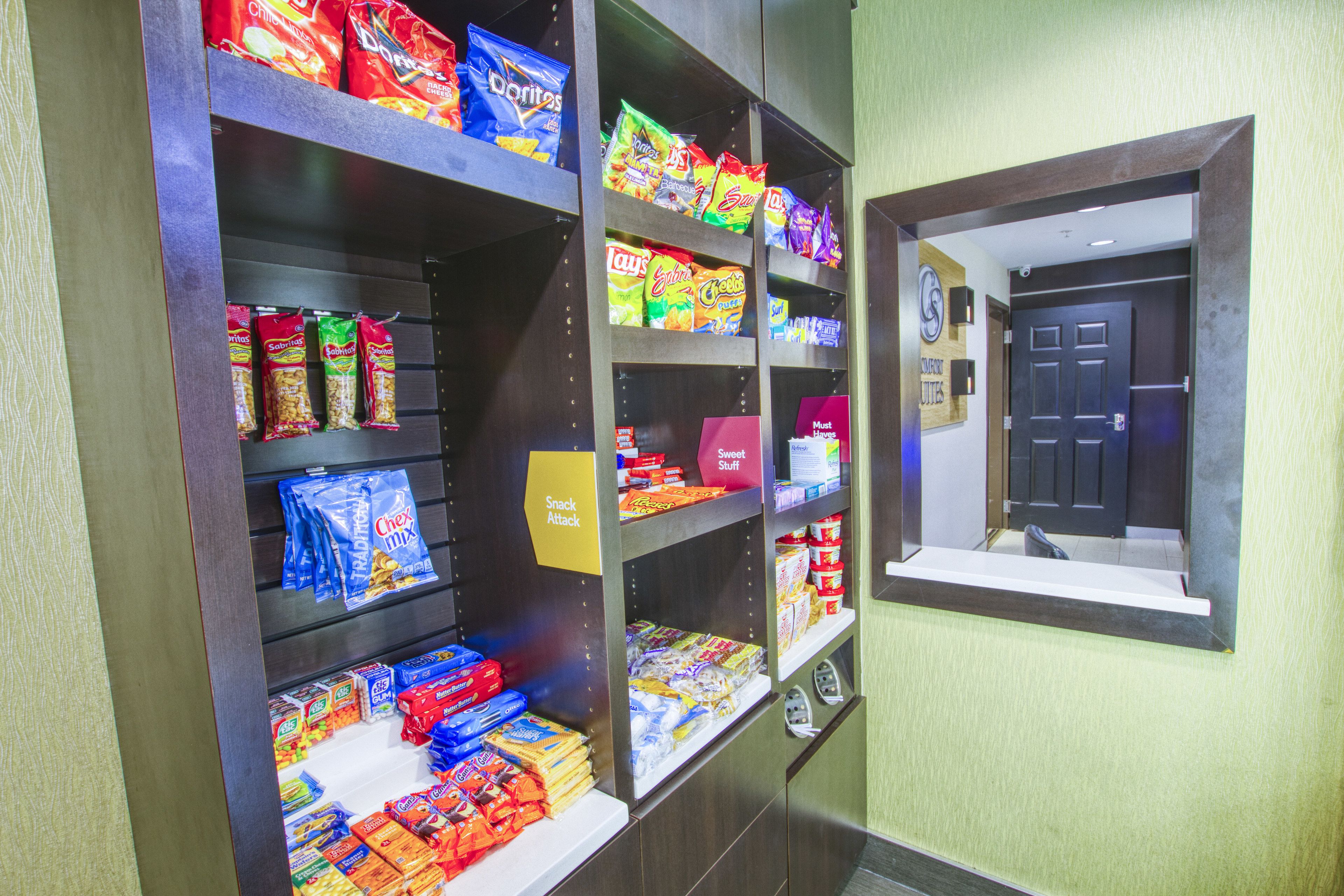 A snack display with various chips and snacks.