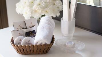 A tray with toiletries including a towel, a box, and a container.