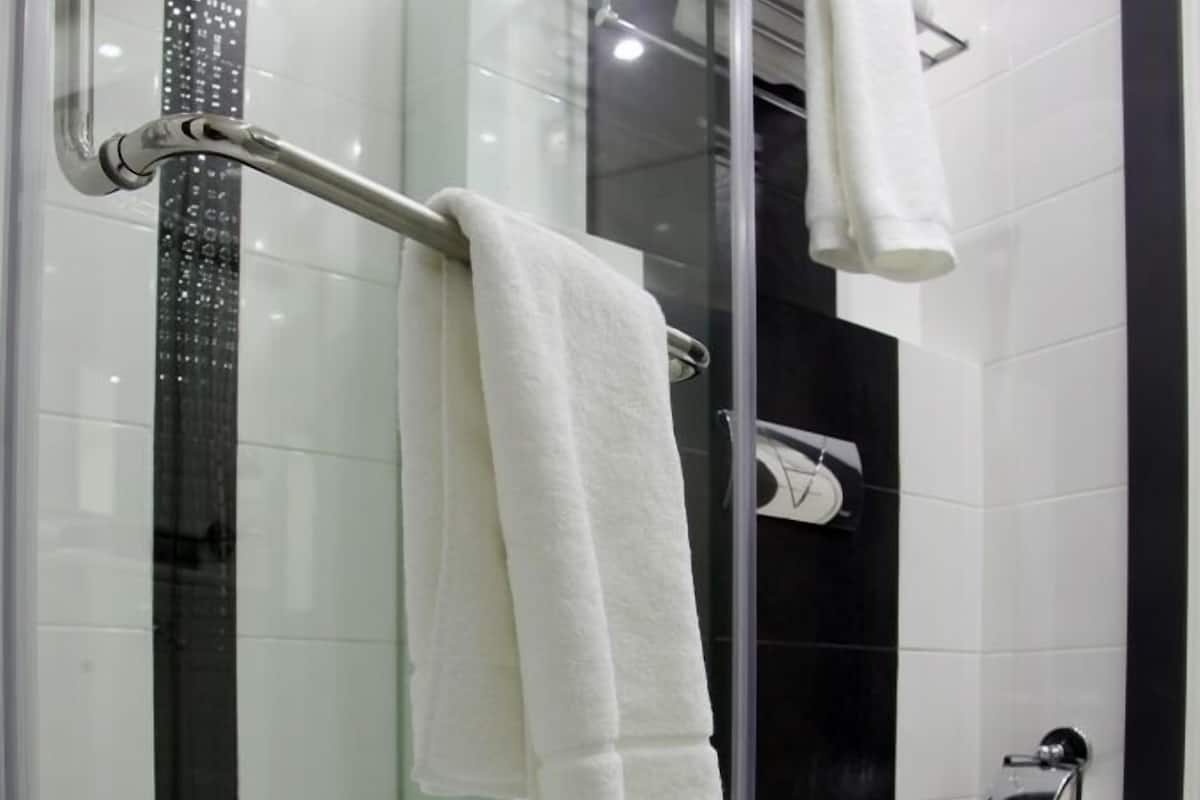 standard single room | bathroom | hair dryer, bathrobes, bidet, towels