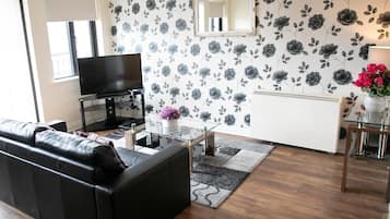 32-inch flat-screen TV with cable channels, TV