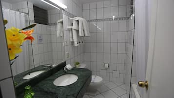 Separate bathtub and shower, hair dryer, towels, soap