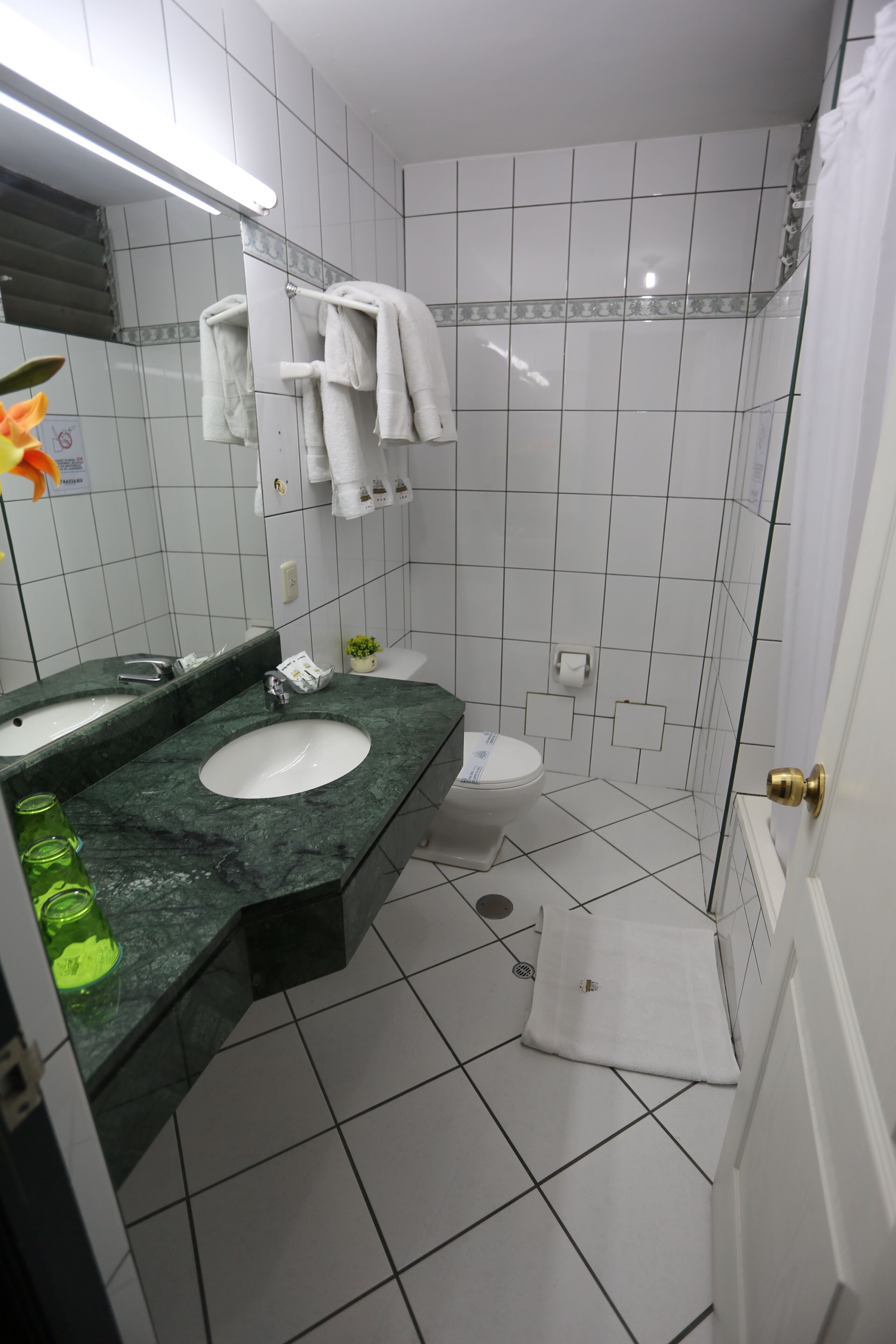 room | bathroom | separate bathtub and shower, hair dryer, towels, soap