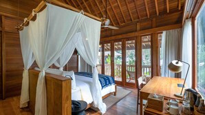A wooden room with a bed, a desk, and a window. - Bhuwana Ubud Hotel and Farm (Ubud)