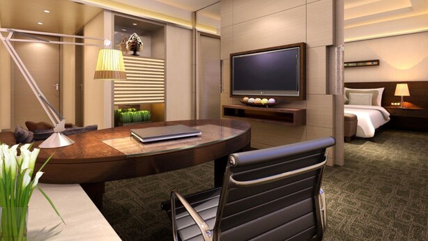 A modern hotel room with a desk, chair, television, bed, and bedside table. - Holiday Inn Xi'an Big Goose Pagoda by IHG (Xi'an)