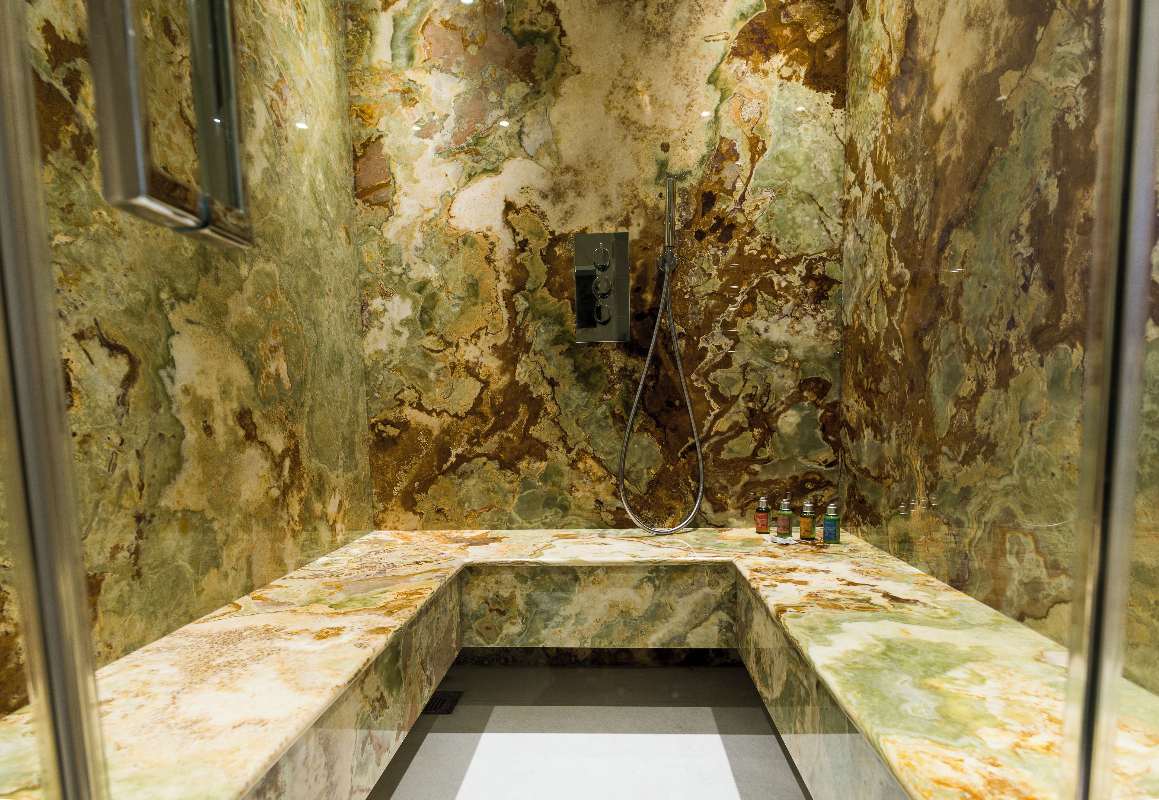 suite, 1 king bed, balcony | bathroom | rainfall showerhead, designer toiletries, hair dryer, towels