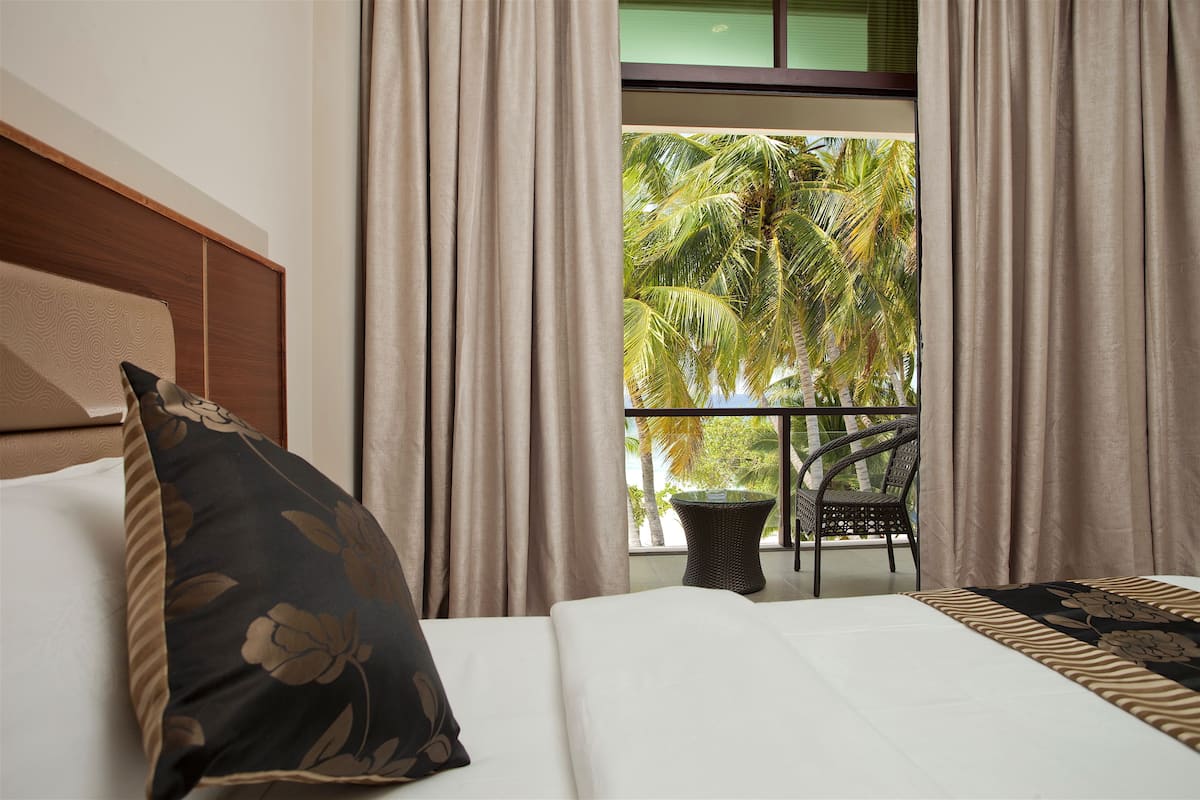 Deluxe Triple Room, Sea View | Premium bedding, pillow-top beds, minibar, in-room safe