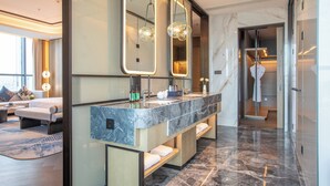 A modern bathroom with a marble vanity, large mirrors, and a walk-in shower. - Crowne Plaza Huaihua by IHG (Huaihua)