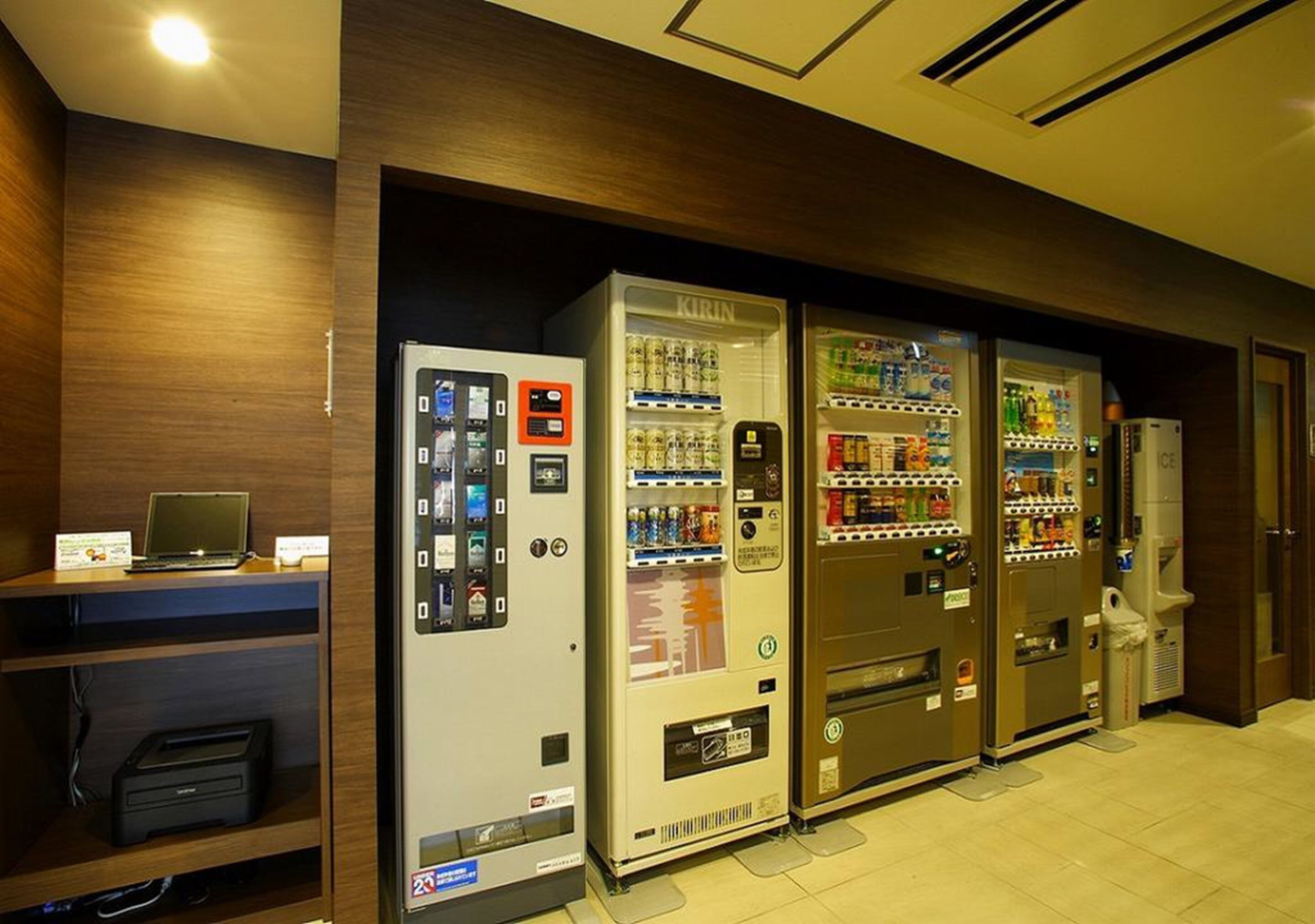 A row of vending machines in a hotel lobby.