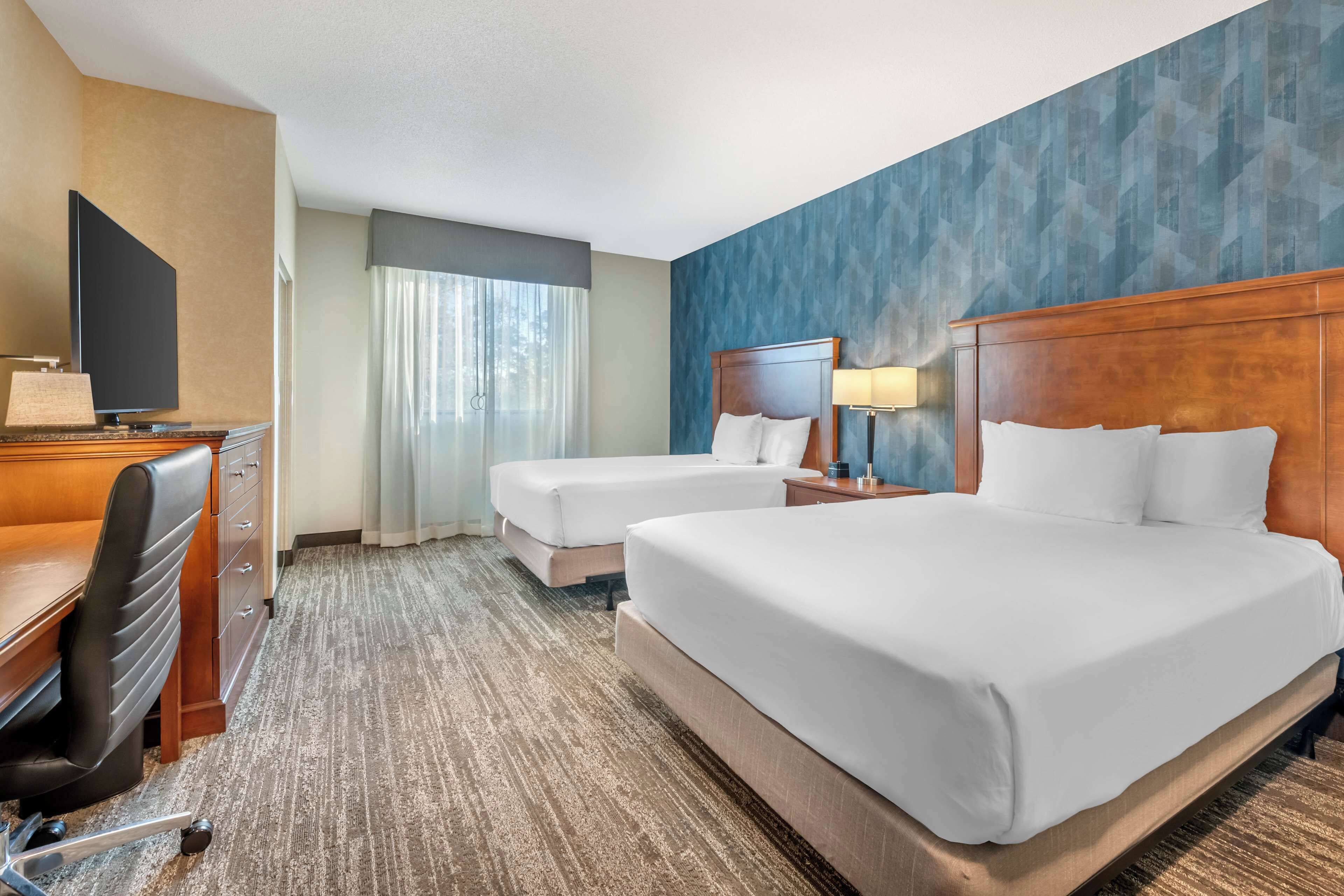 suite, 2 queen beds, accessible, refrigerator & microwave (sofabed, 2 rooms, tub) | blackout curtains, iron/ironing board, free cots/infant beds