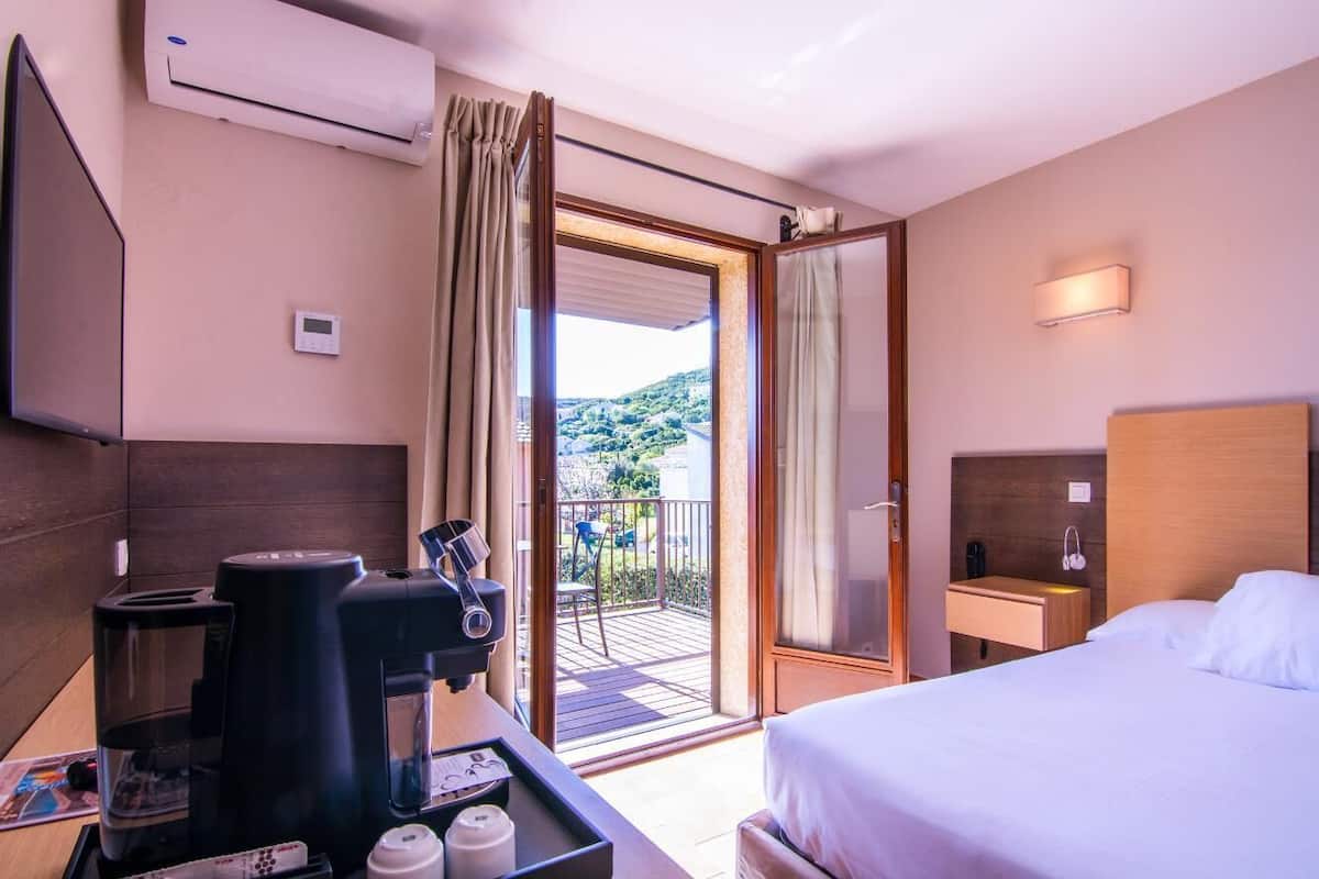 standard double room, terrace | minibar, in-room safe, desk, blackout curtains