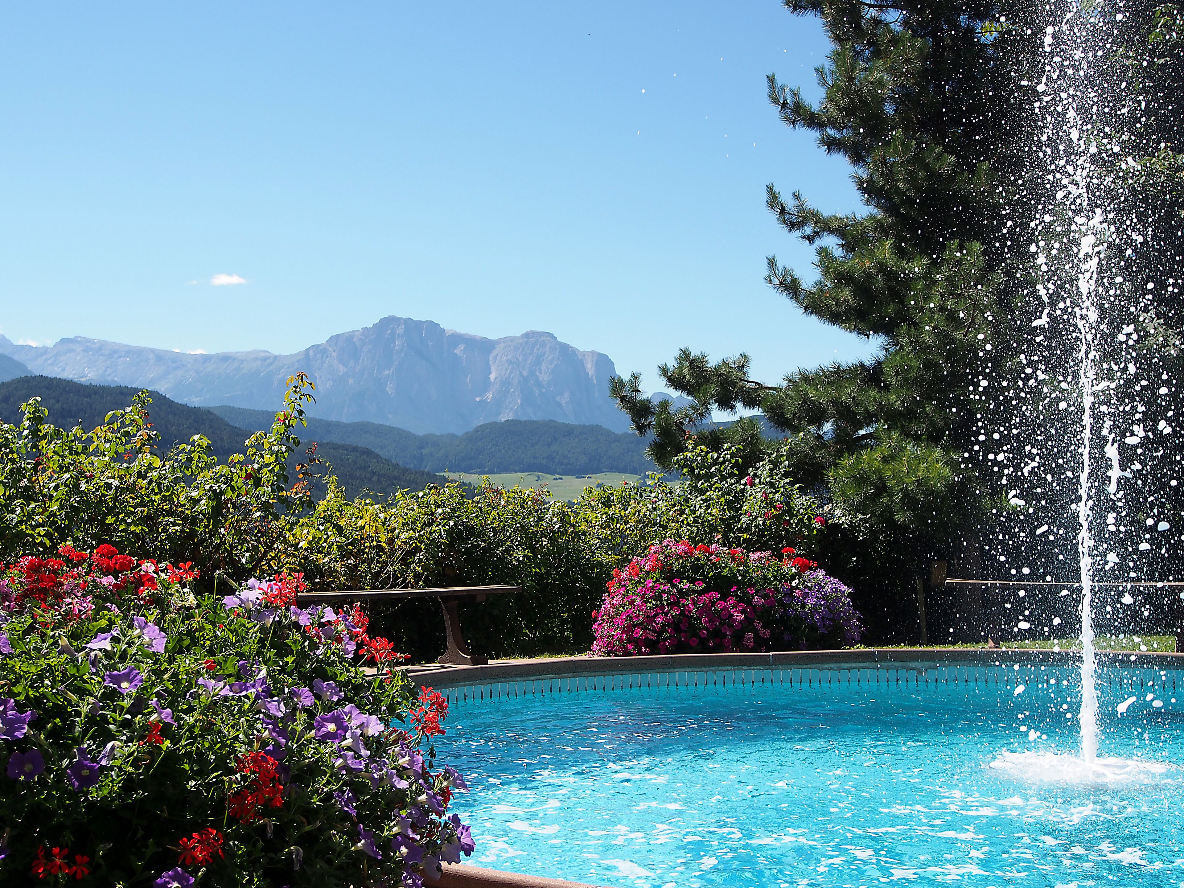 Indoor pool, seasonal outdoor pool, pool umbrellas, pool loungers