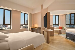Deluxe kamer, 1 kingsize bed met slaapbank | Woonruimte