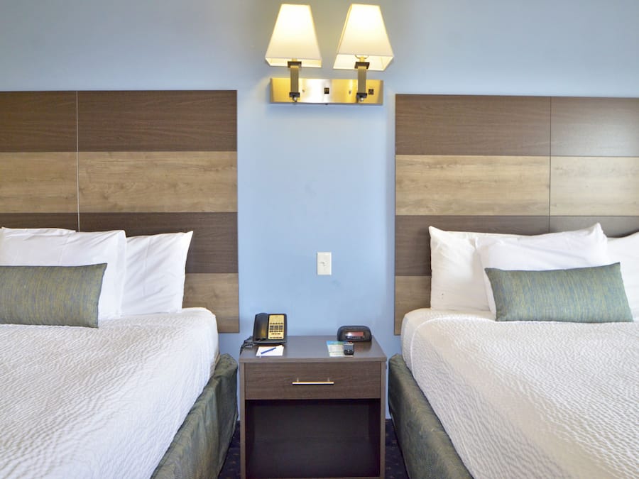 Suite, City View (2 Queens/Sofa, No pets allowed) | Blackout drapes, iron/ironing board, free WiFi, bed sheets