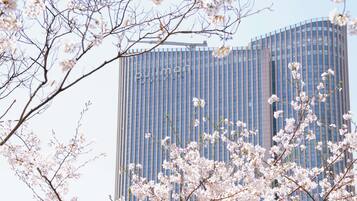 A modern building with a vertical facade and the name "Pullman Hotel" visible.
