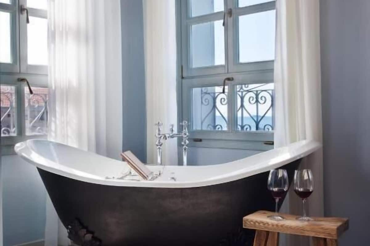 royal suite | bathroom | hair dryer, bathrobes, slippers, towels